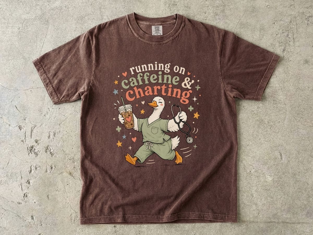 Caffeine & Charting T‑Shirt — Cute Goose Nurse with Coffee Graphic