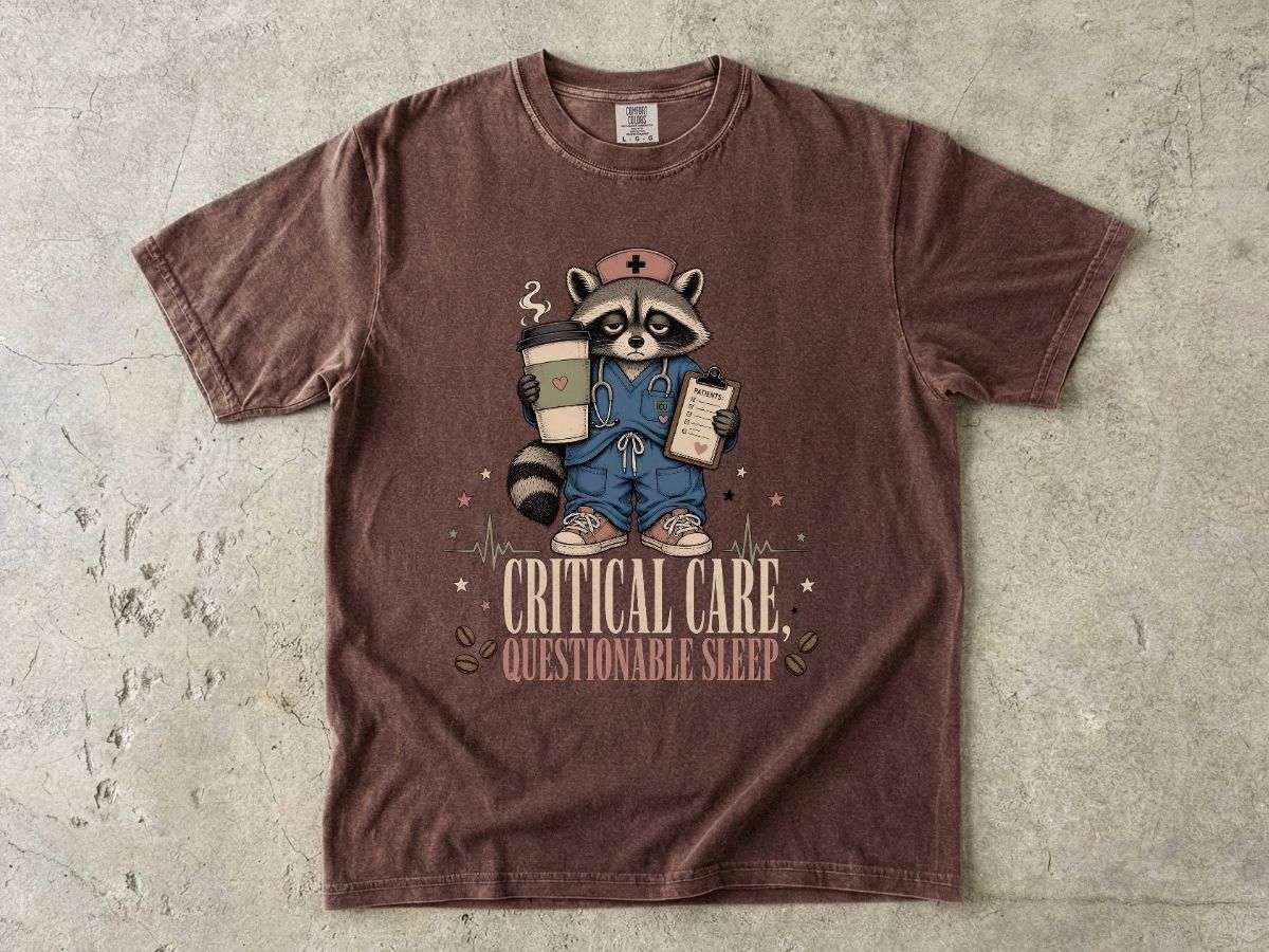 T‑Shirt — "Critical Care, Questionable Sleep" Raccoon Nurse Graphic Tee