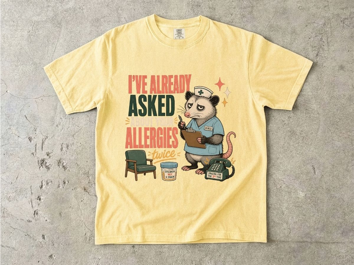 T‑Shirt — "I've Already Asked About Your Allergies Twice" Nurse Possum Graphic