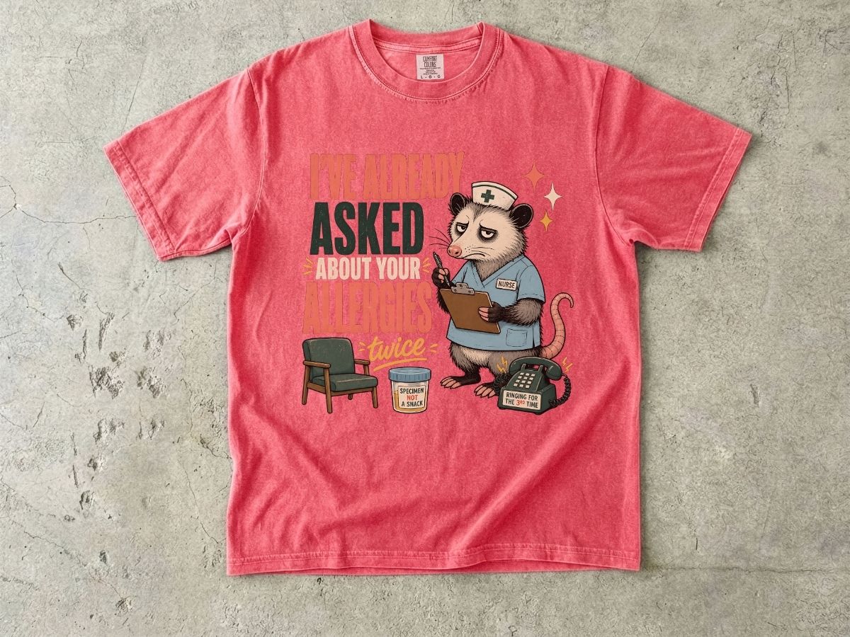 T‑Shirt — "I've Already Asked About Your Allergies Twice" Nurse Possum Graphic