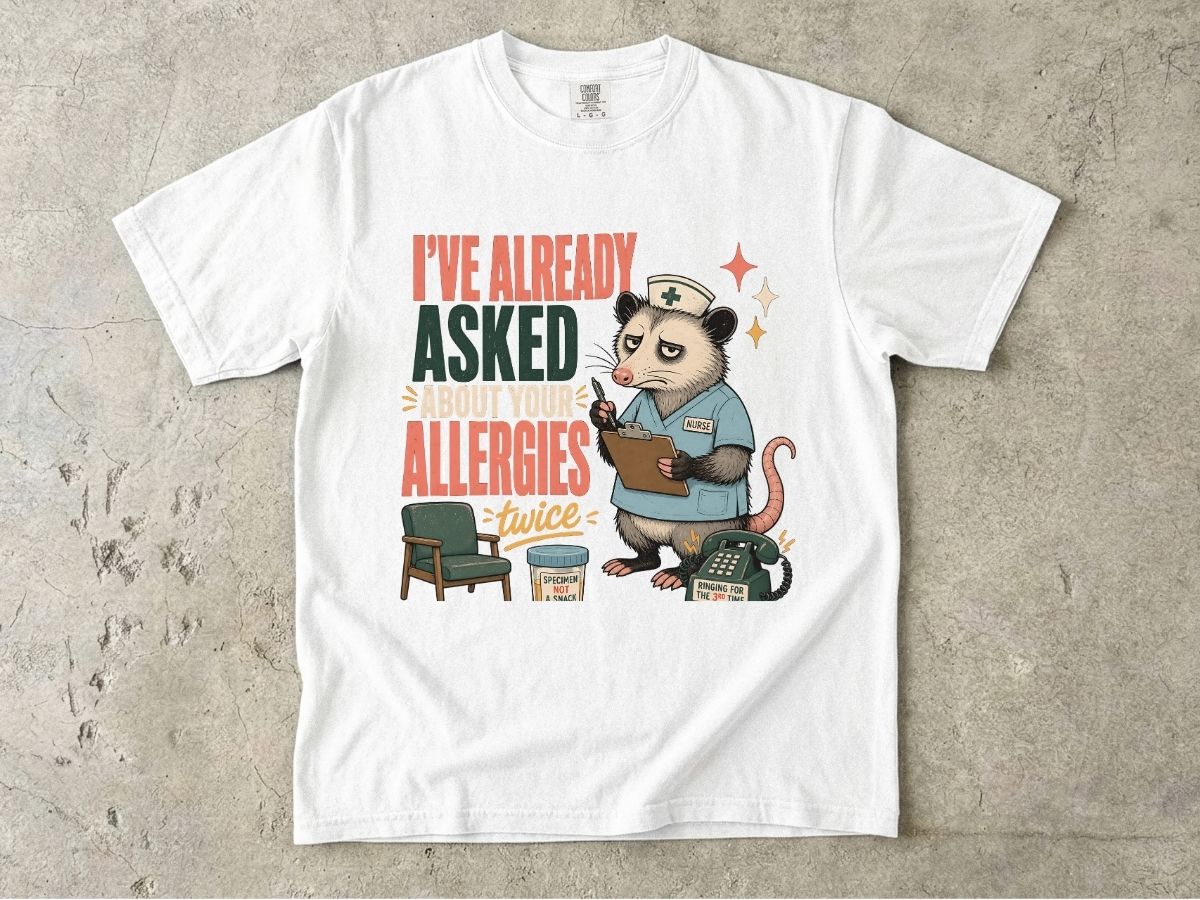 T‑Shirt — "I've Already Asked About Your Allergies Twice" Nurse Possum Graphic