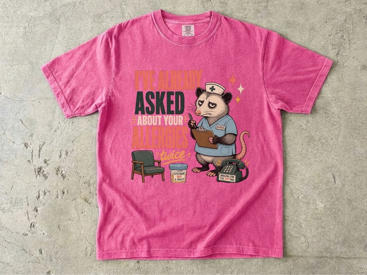 T‑Shirt — "I've Already Asked About Your Allergies Twice" Nurse Possum Graphic