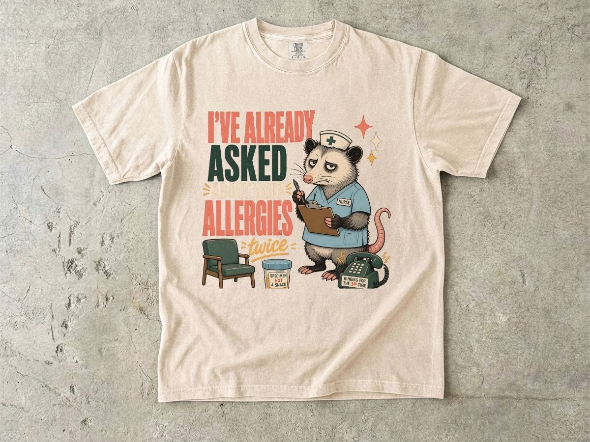 T‑Shirt — "I've Already Asked About Your Allergies Twice" Nurse Possum Graphic