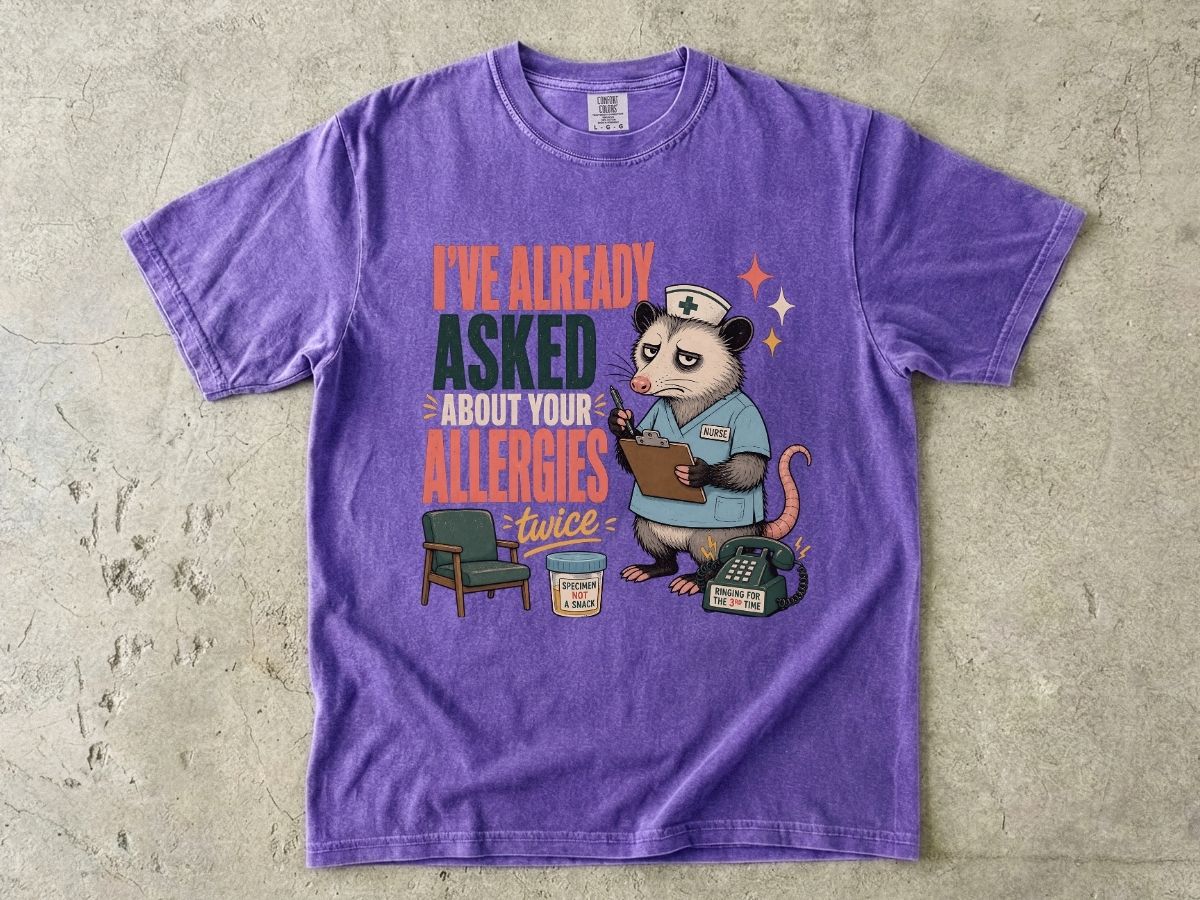 T‑Shirt — "I've Already Asked About Your Allergies Twice" Nurse Possum Graphic