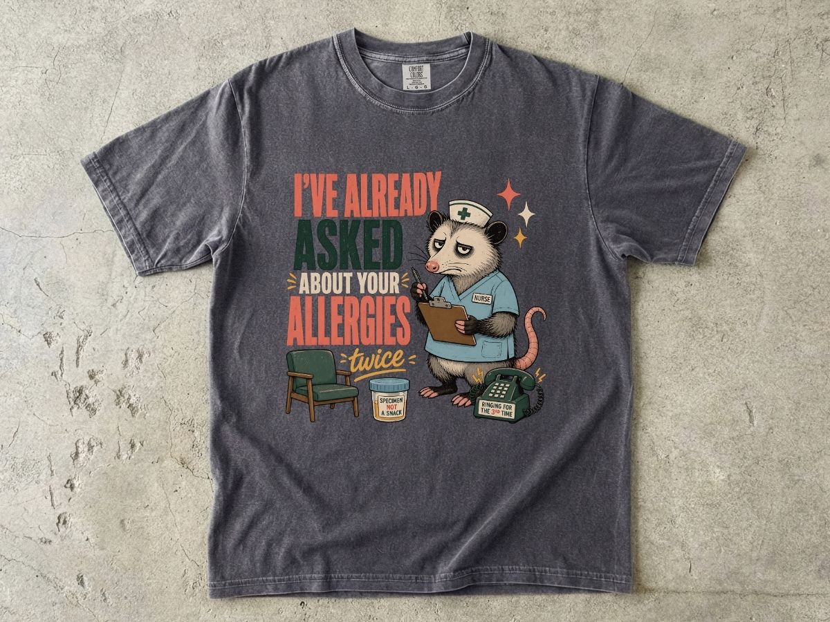 T‑Shirt — "I've Already Asked About Your Allergies Twice" Nurse Possum Graphic