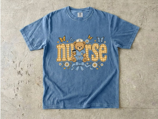 Nurse Teddy Bear T‑Shirt — Cute Nursing Gift with Plaid Lettering & Butterflies