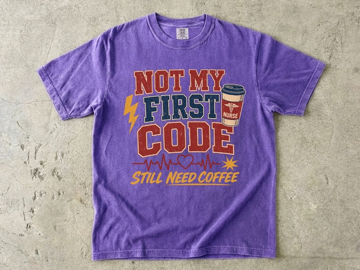 "Not My First Code, Still Need Coffee" bold retro Comfort Colors tee. Funny ER/ICU nurse gift shirt.