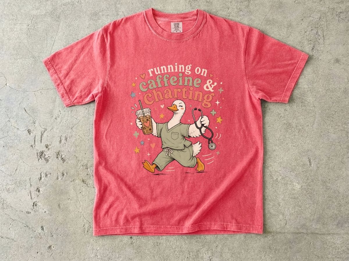 Caffeine & Charting T‑Shirt — Cute Goose Nurse with Coffee Graphic