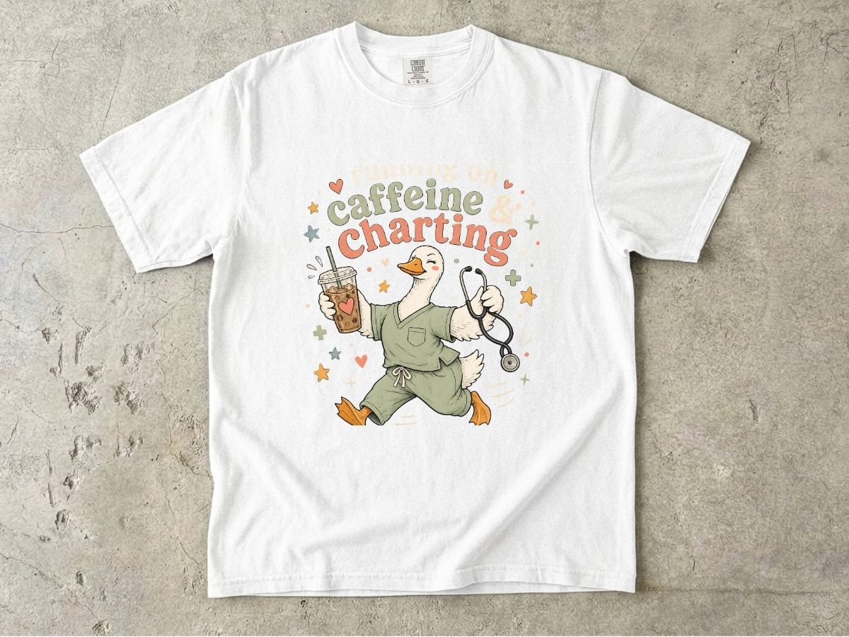 Caffeine & Charting T‑Shirt — Cute Goose Nurse with Coffee Graphic