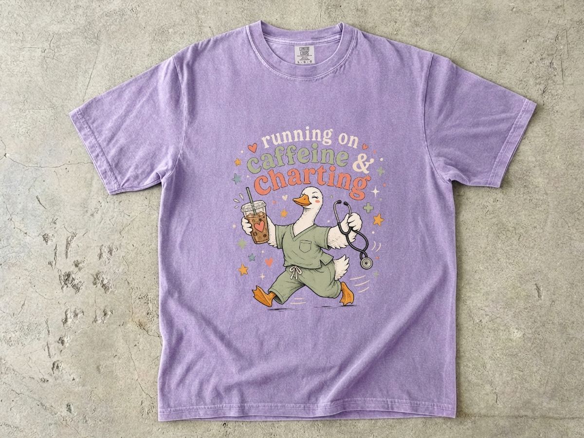 Caffeine & Charting T‑Shirt — Cute Goose Nurse with Coffee Graphic