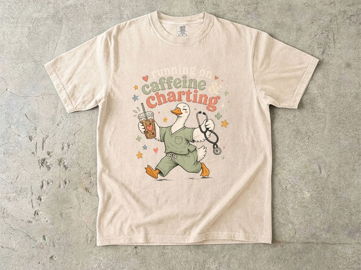 Caffeine & Charting T‑Shirt — Cute Goose Nurse with Coffee Graphic