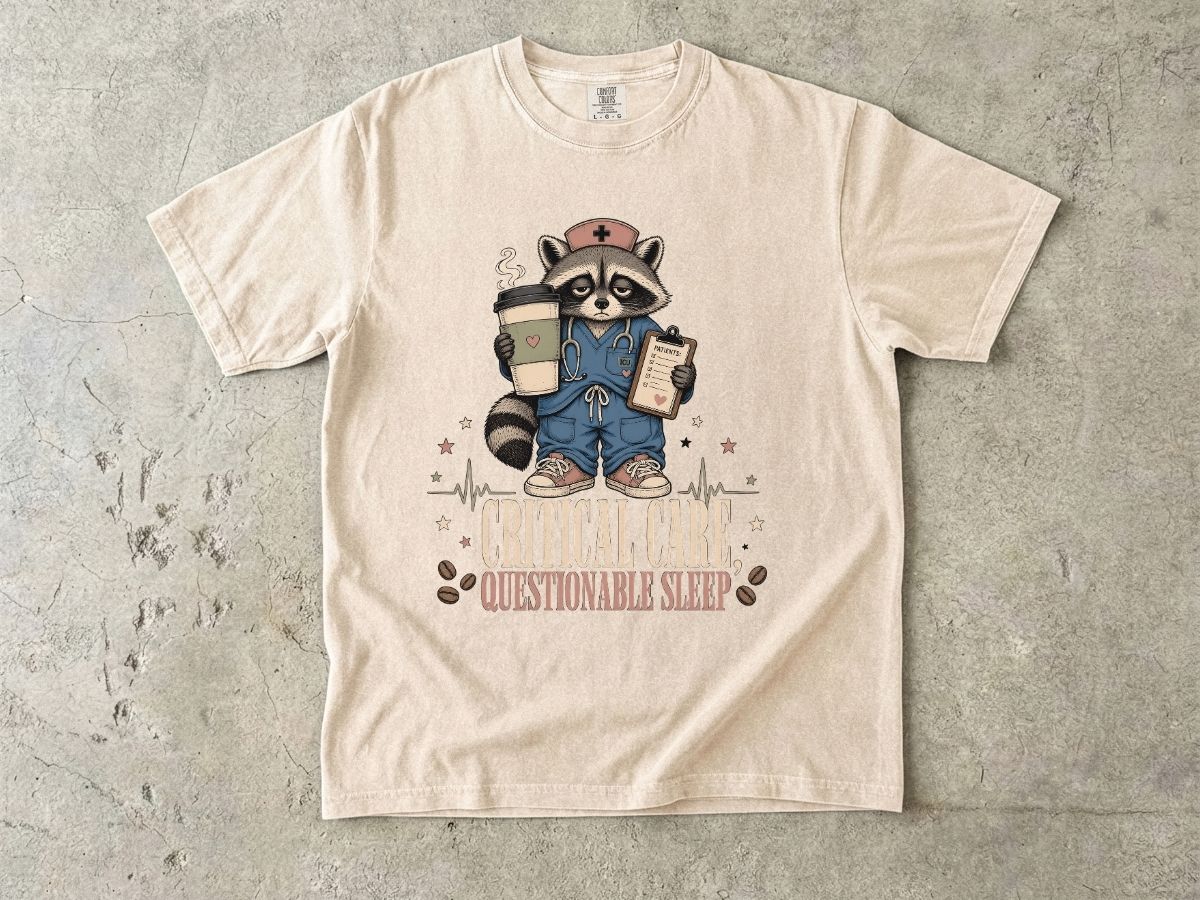 T‑Shirt — "Critical Care, Questionable Sleep" Raccoon Nurse Graphic Tee