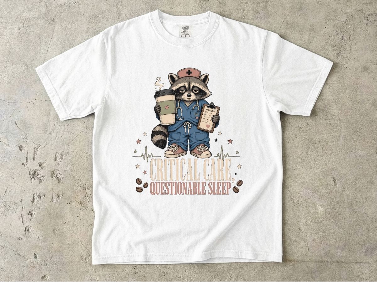 T‑Shirt — "Critical Care, Questionable Sleep" Raccoon Nurse Graphic Tee