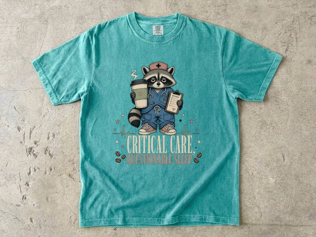 T‑Shirt — "Critical Care, Questionable Sleep" Raccoon Nurse Graphic Tee