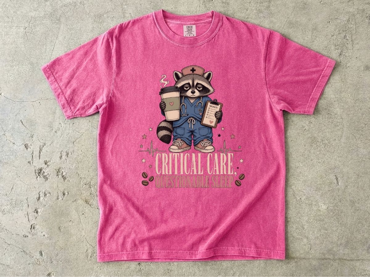 T‑Shirt — "Critical Care, Questionable Sleep" Raccoon Nurse Graphic Tee