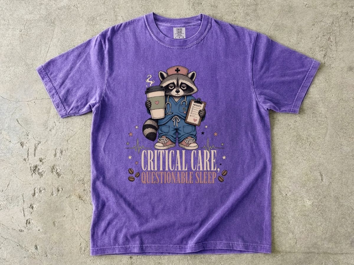 T‑Shirt — "Critical Care, Questionable Sleep" Raccoon Nurse Graphic Tee