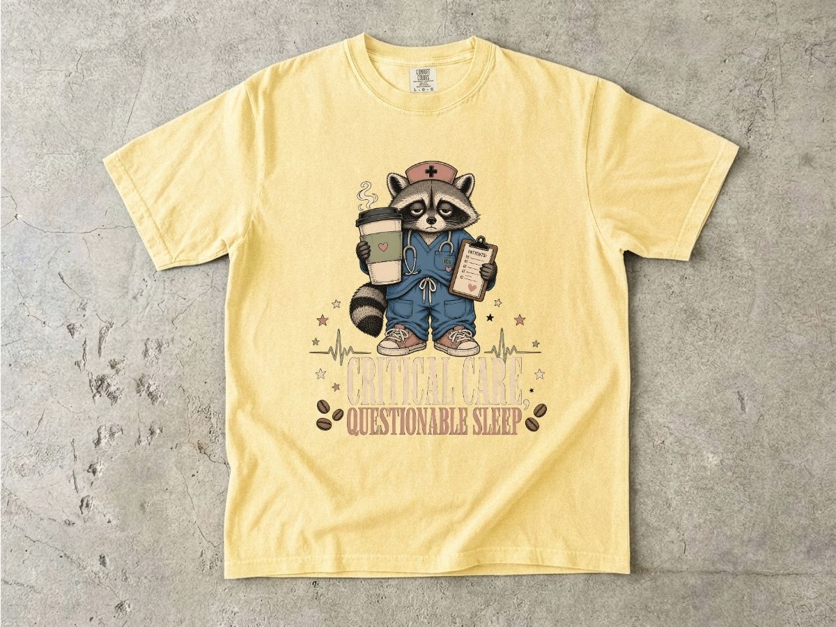 T‑Shirt — "Critical Care, Questionable Sleep" Raccoon Nurse Graphic Tee