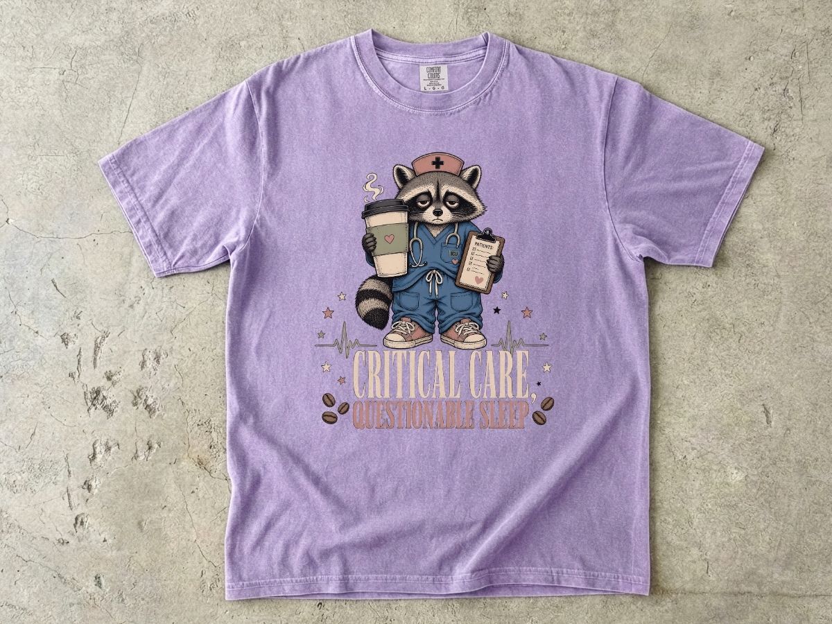 T‑Shirt — "Critical Care, Questionable Sleep" Raccoon Nurse Graphic Tee