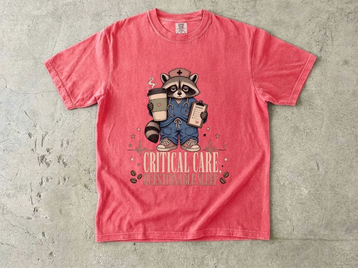 T‑Shirt — "Critical Care, Questionable Sleep" Raccoon Nurse Graphic Tee